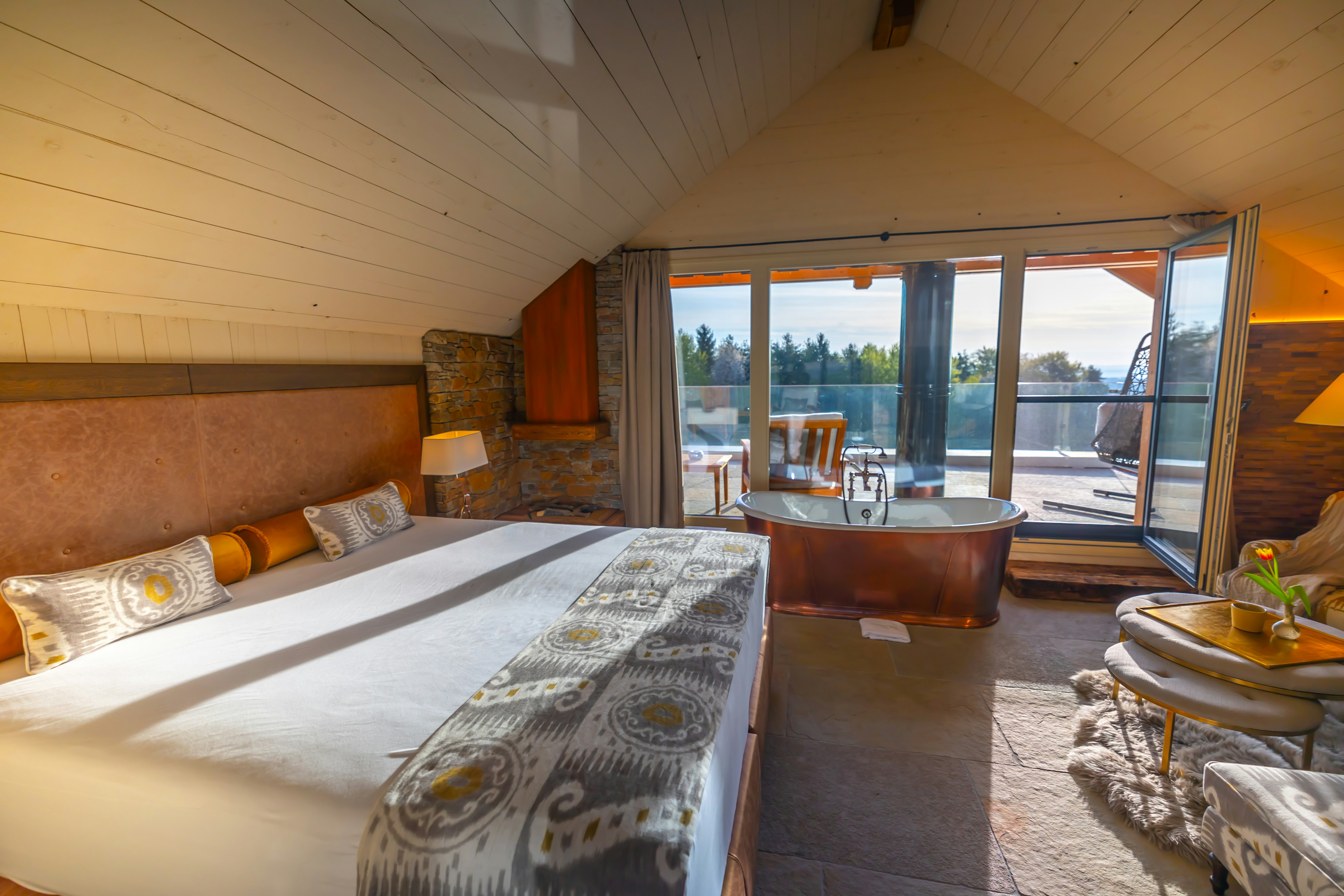 a bedroom with a view of the ocean