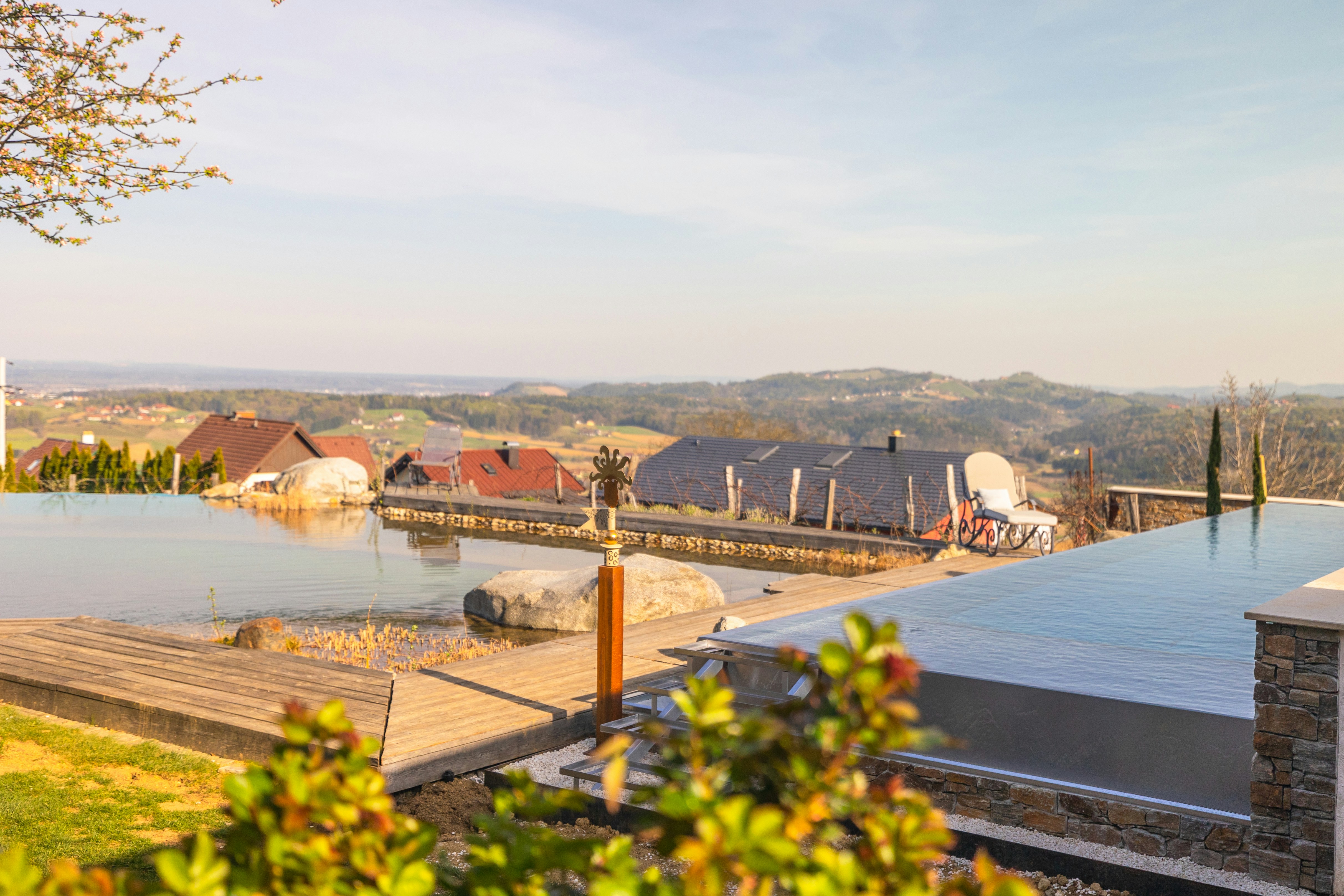 Infinity pool overlooking Tuscan hills at sunset
