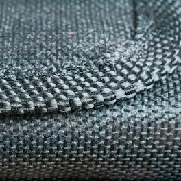 Close-up of handwoven textile goods showcasing intricate patterns and rich textures.
