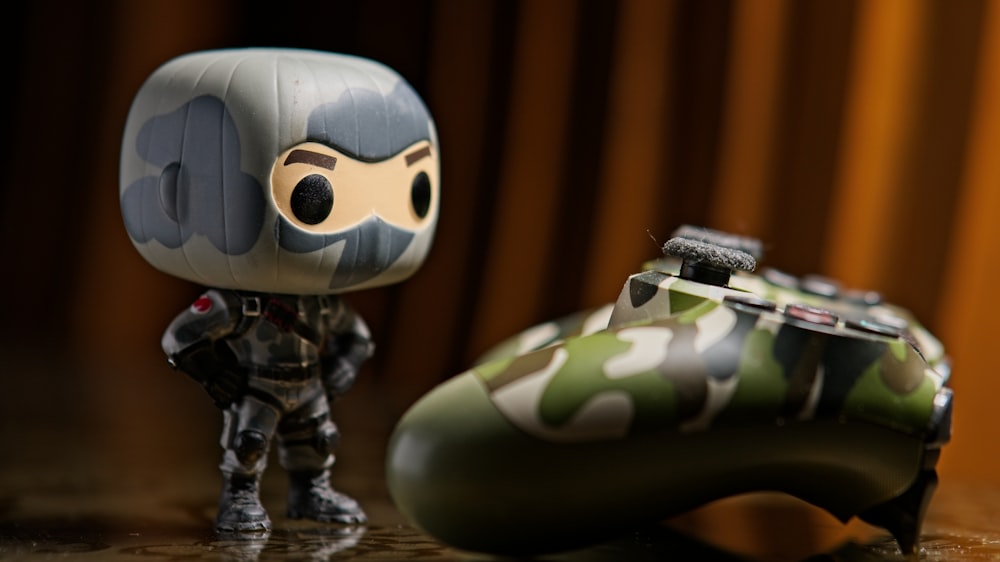 a toy figurine next to a helmet