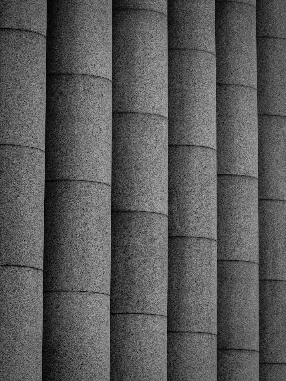 a row of grey pillars