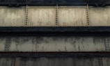 Close-up of rusted steel beams and metal pieces in a recycling facility.