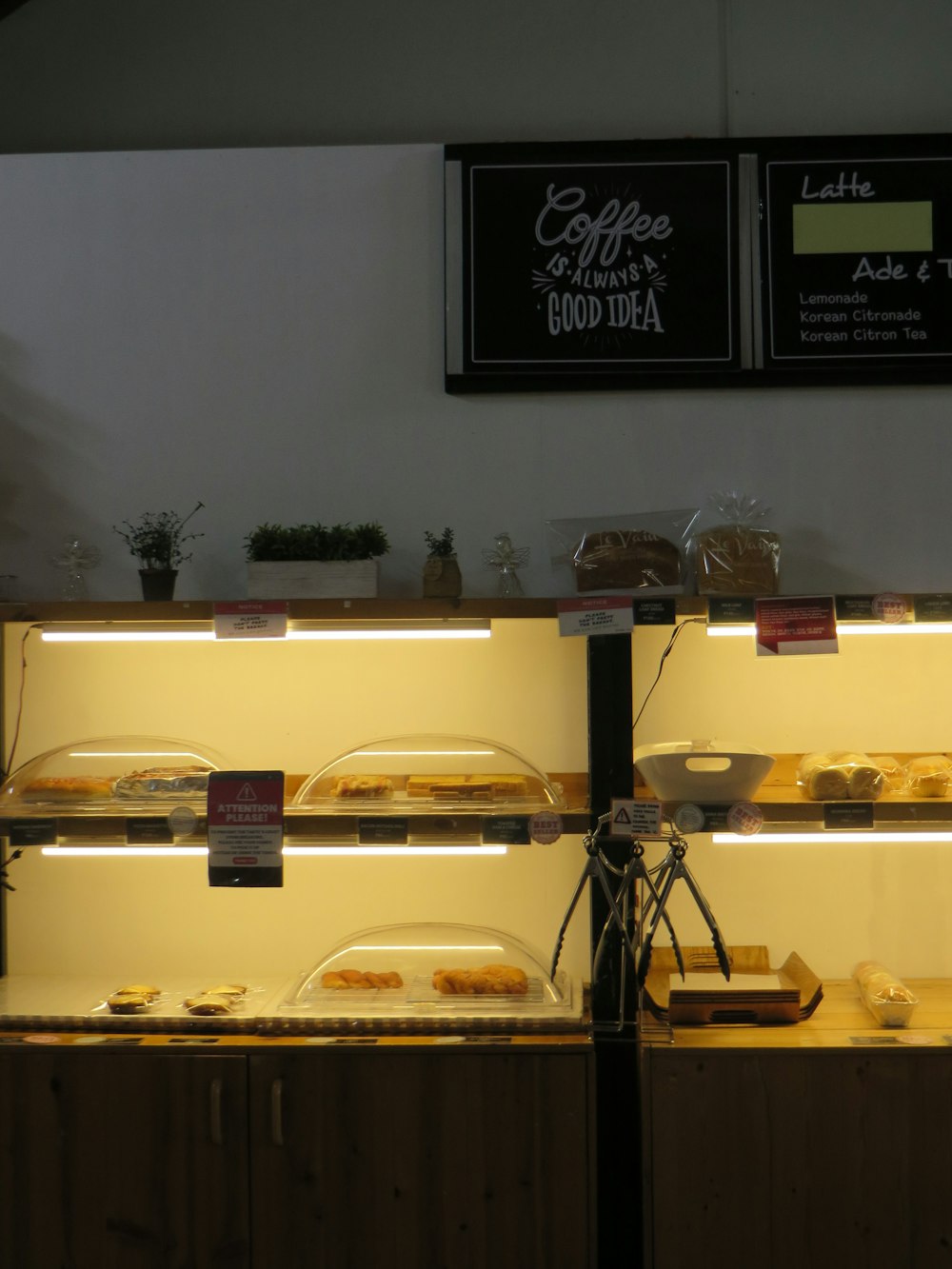 a counter with a sign and a camera on it