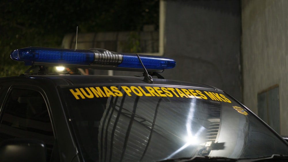 a police car with a blue light on top