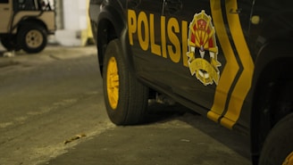 a yellow car with a black tire