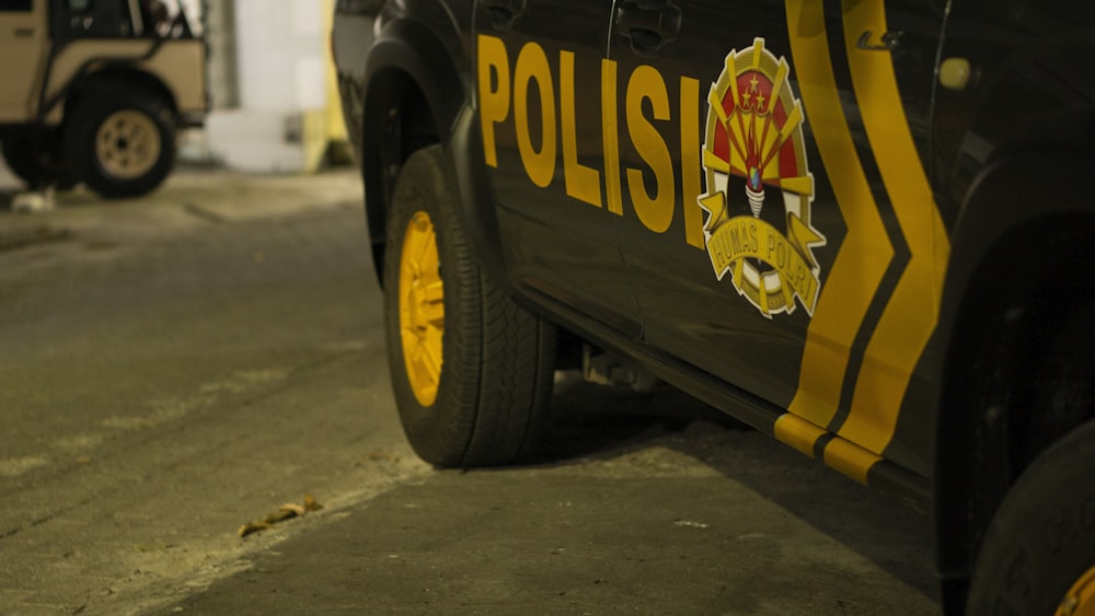 a yellow car with a black tire