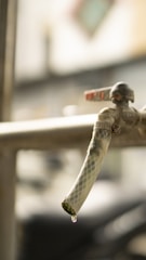 A close-up of a handyman fixing a faucet.