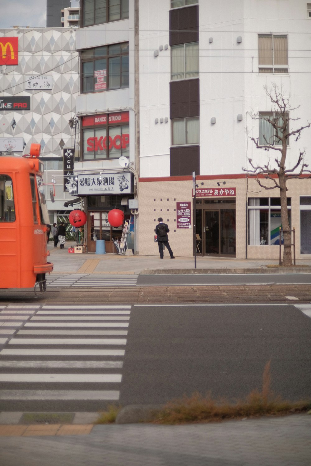 a person walking on a sidewalk