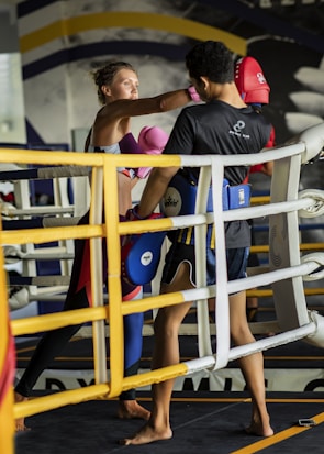 a man and woman in a boxing ring