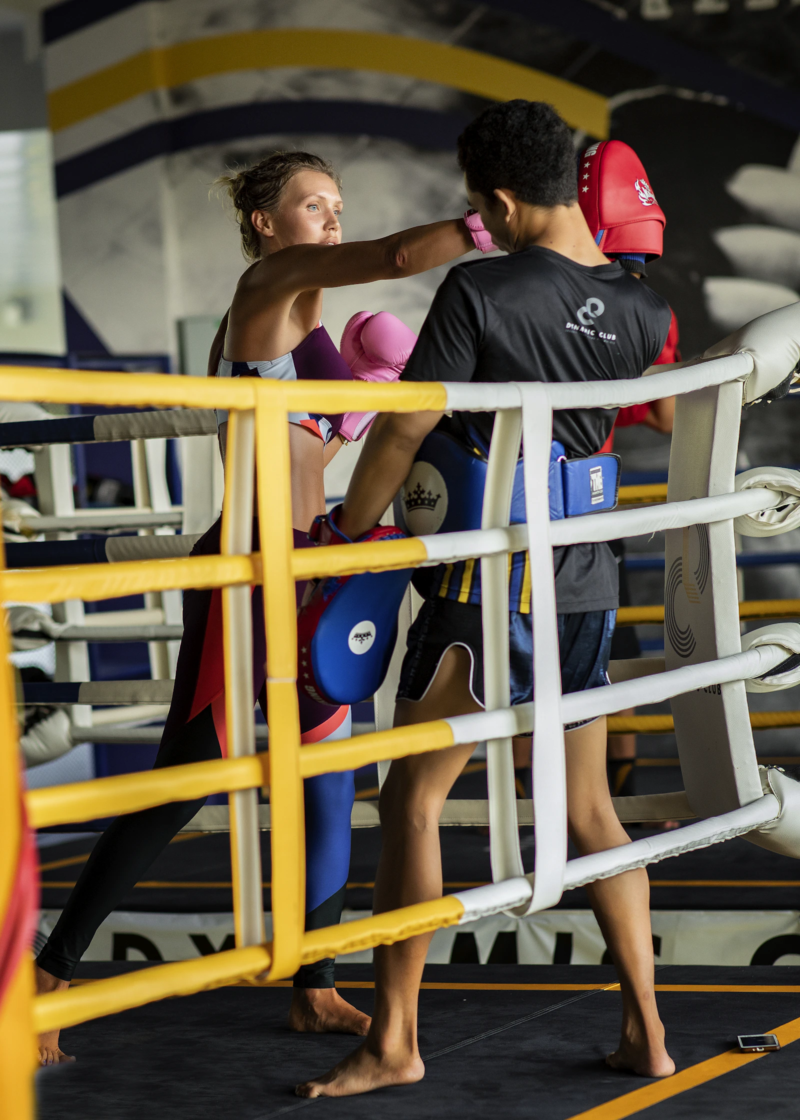 Two fighters training together in a Muay Thai ring