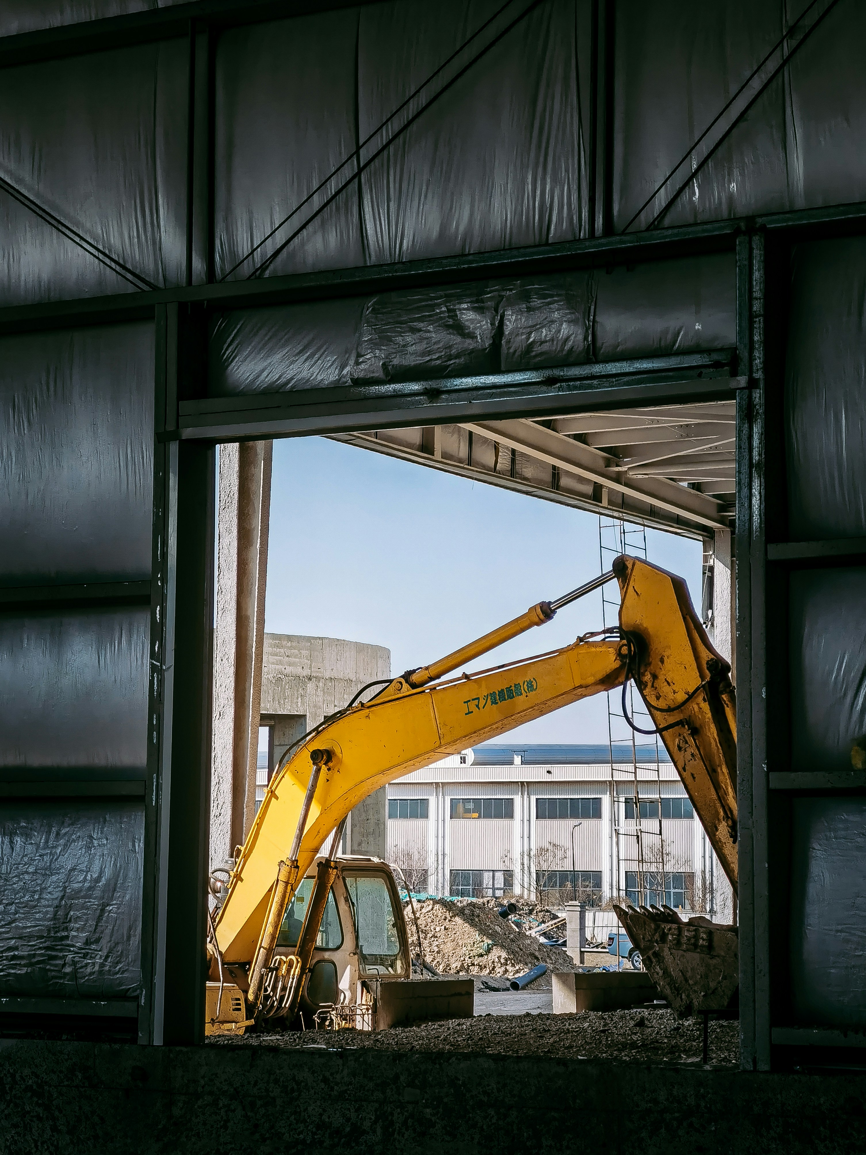 a yellow crane in a building