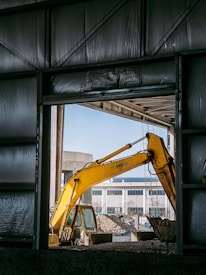 a yellow crane in a building