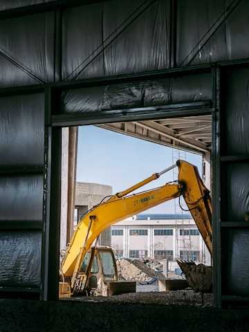 a yellow crane in a building