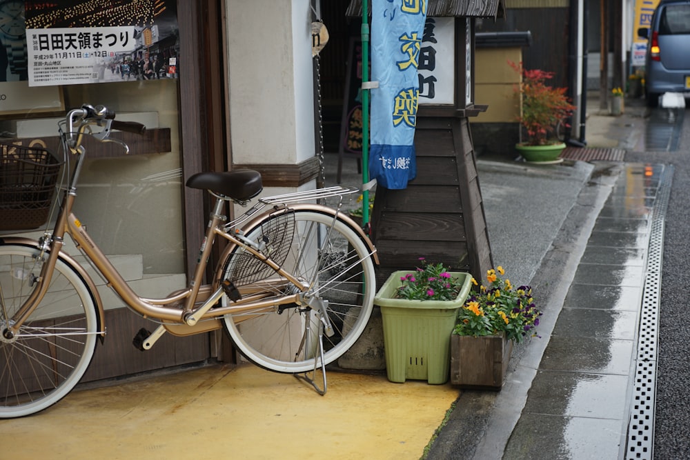 a bicycle parked on a sidewalk