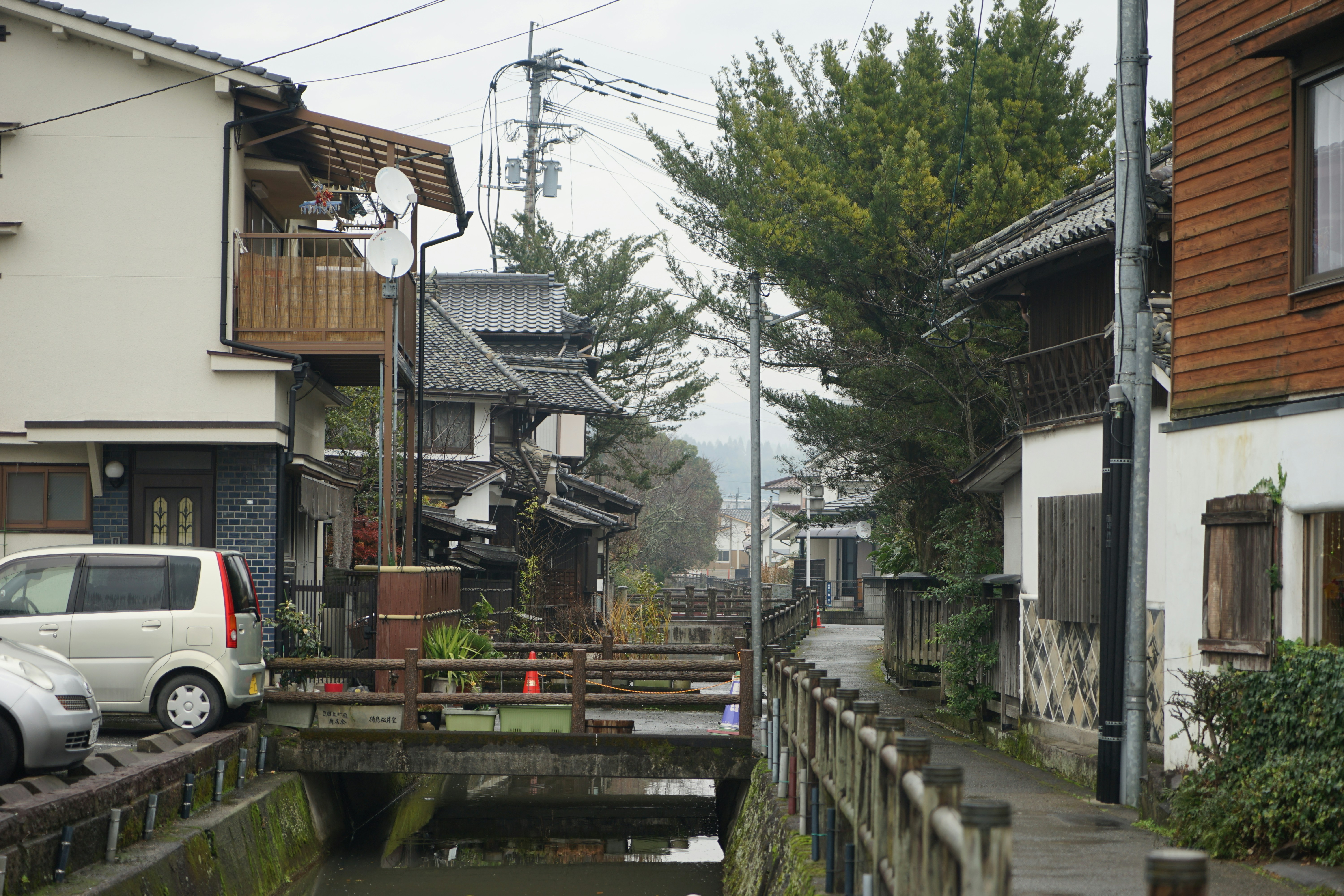 a small river between buildings