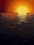 a sunset over a body of water