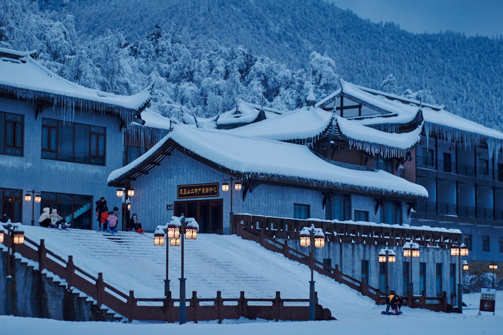 a building with a snowy mountain in the background