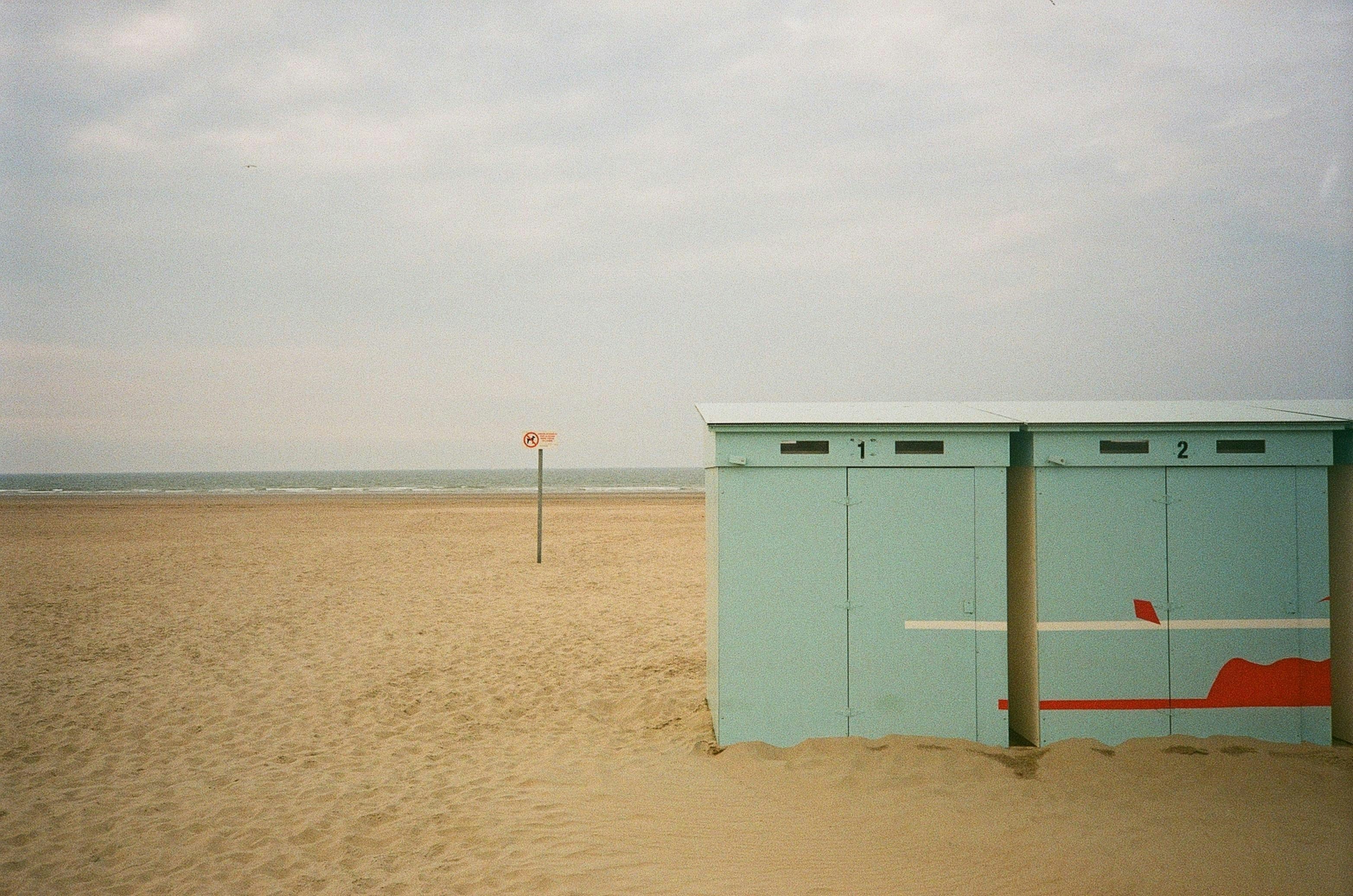 a blue shed in the sand