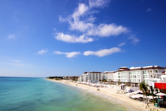 a beach with buildings along it