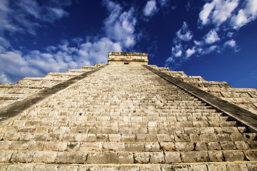 a stone pyramid with a blue sky