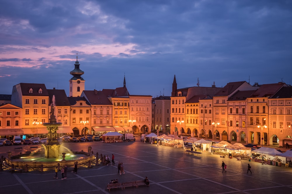 a city square with buildings and people