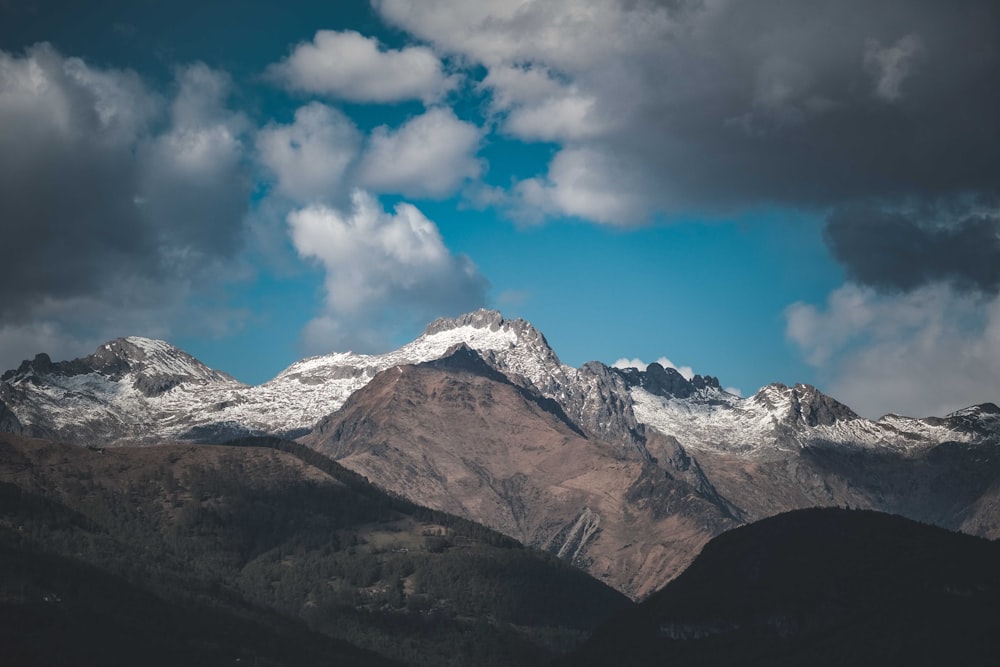 a mountain range with clouds