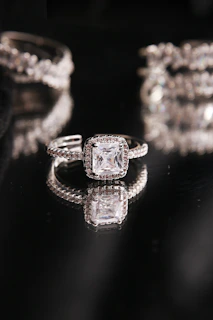 a diamond ring on a black background