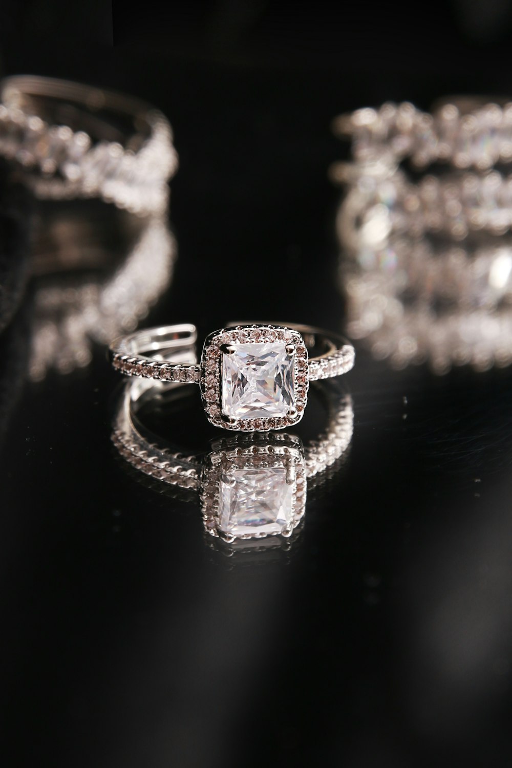 a diamond ring on a black background