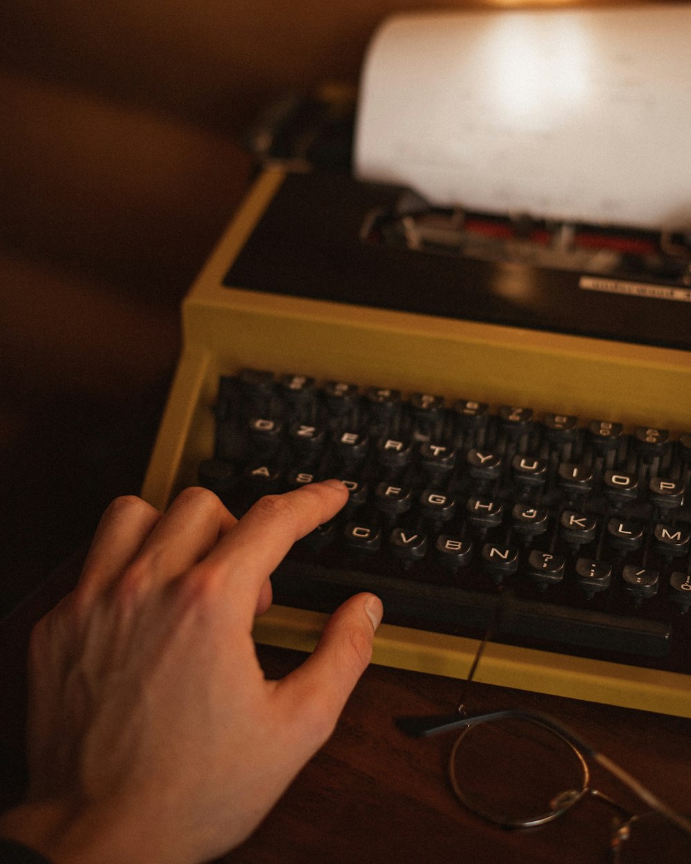 a hand on a keyboard