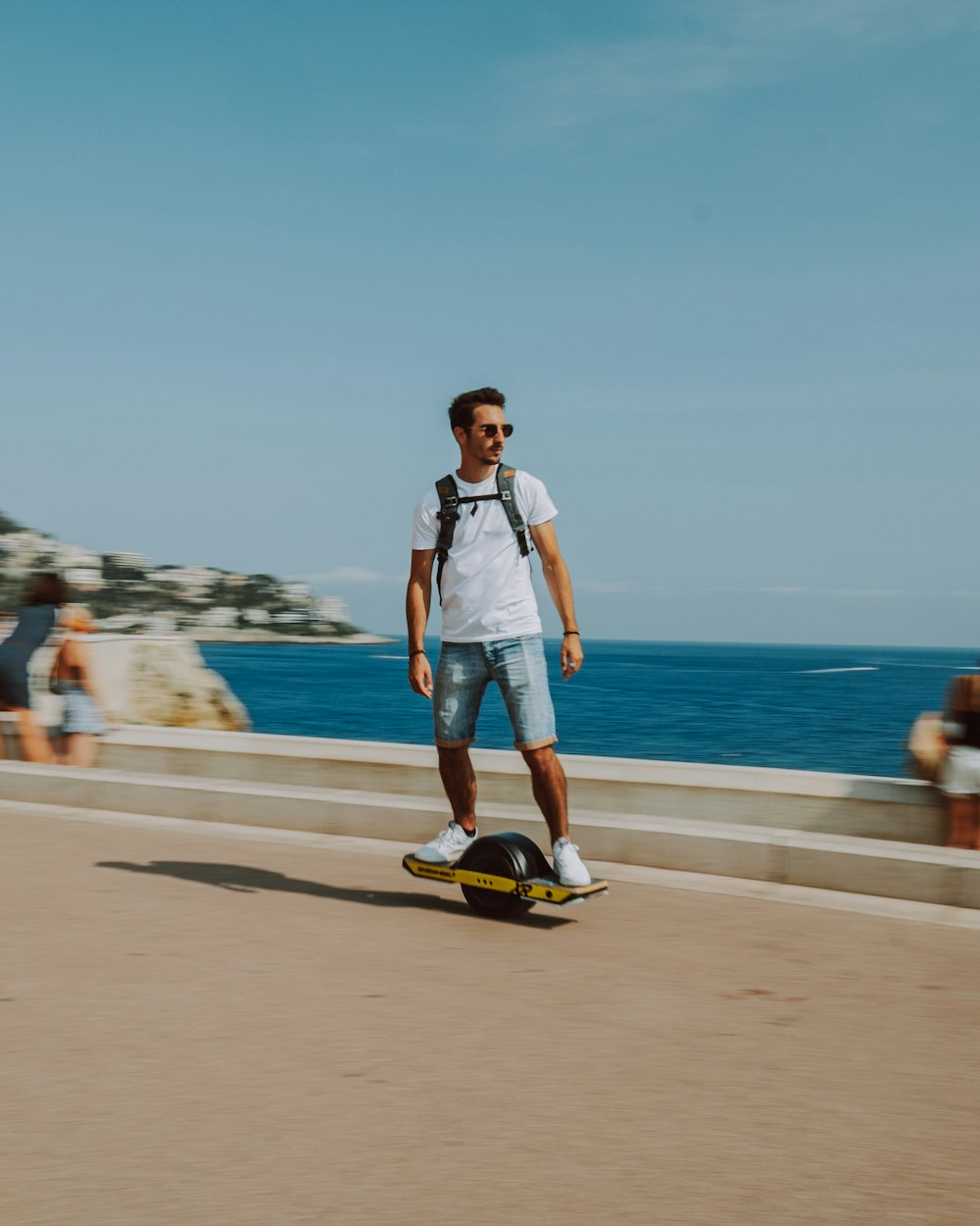 a person riding a skate board at a beach