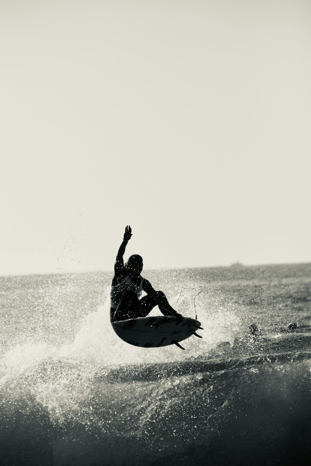 a man riding a surfboard