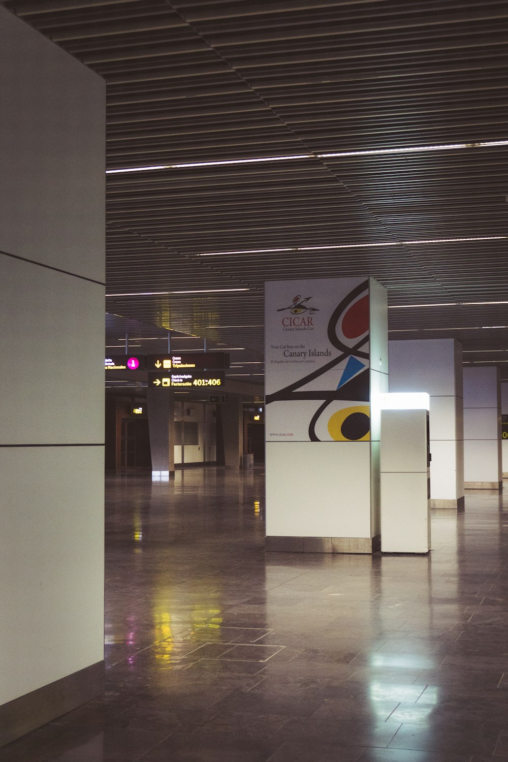 a hallway with a sign on the wall