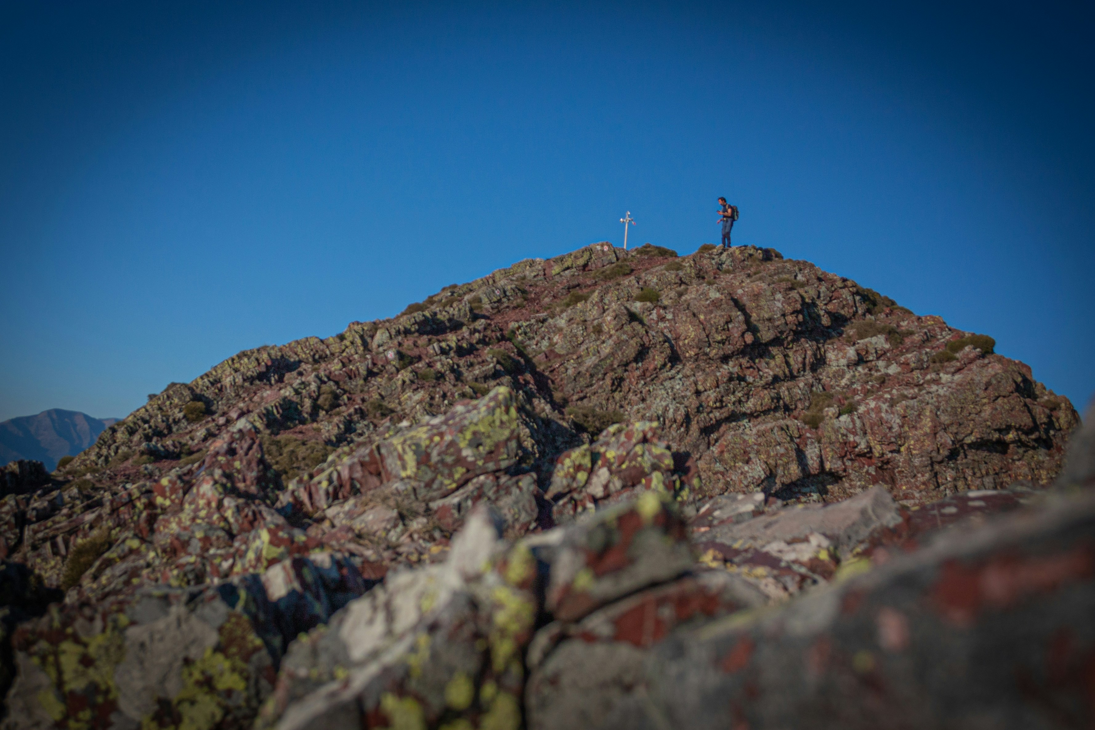 a couple people on top of a mountain