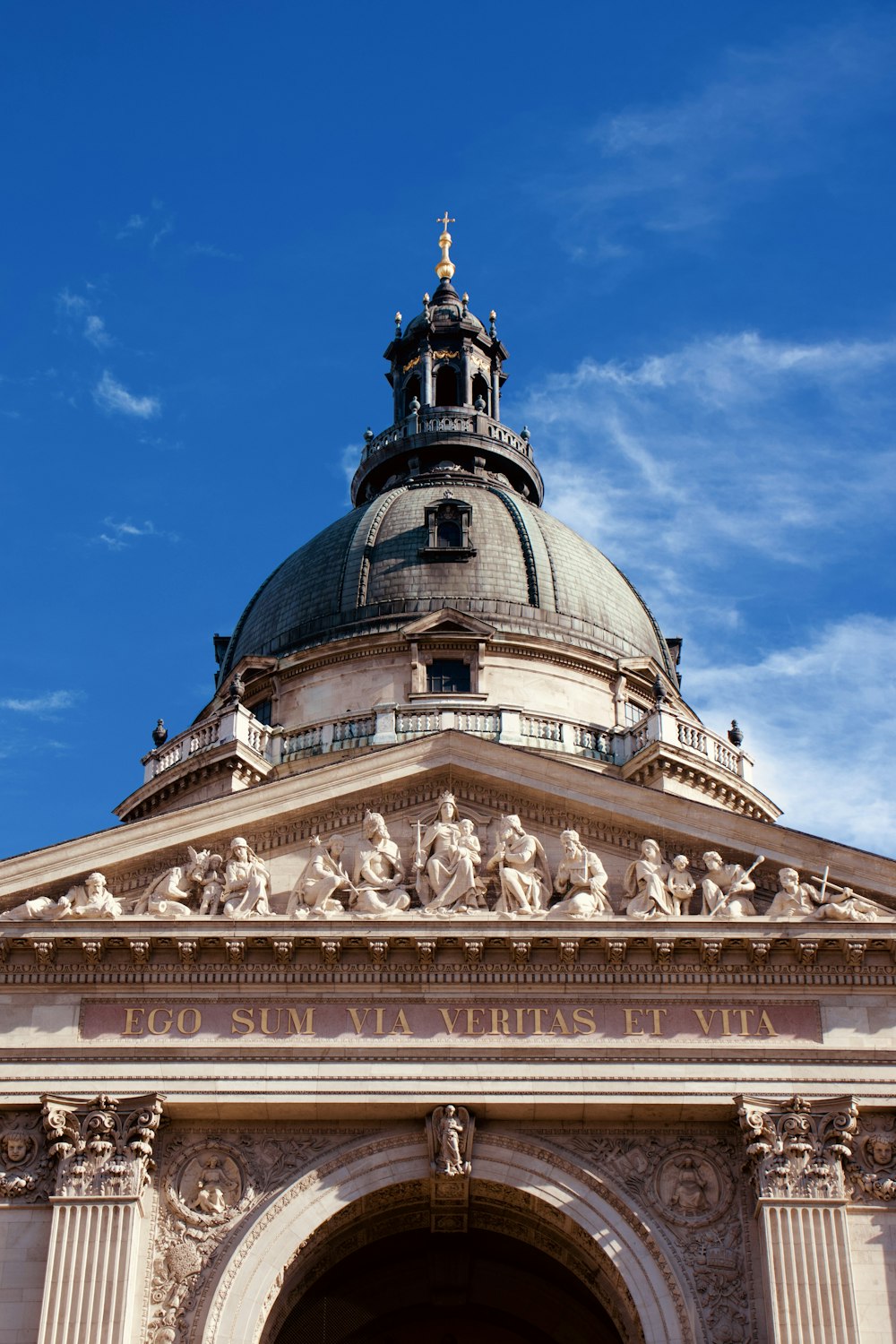 a building with a dome and statues