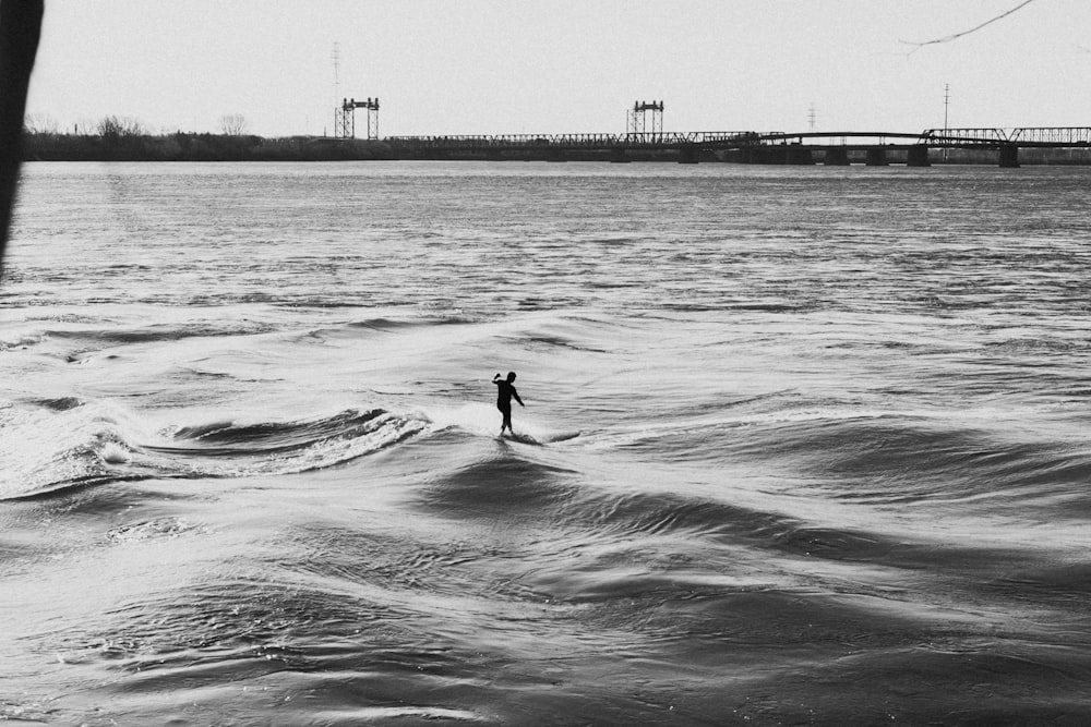 a person surfing in the sea