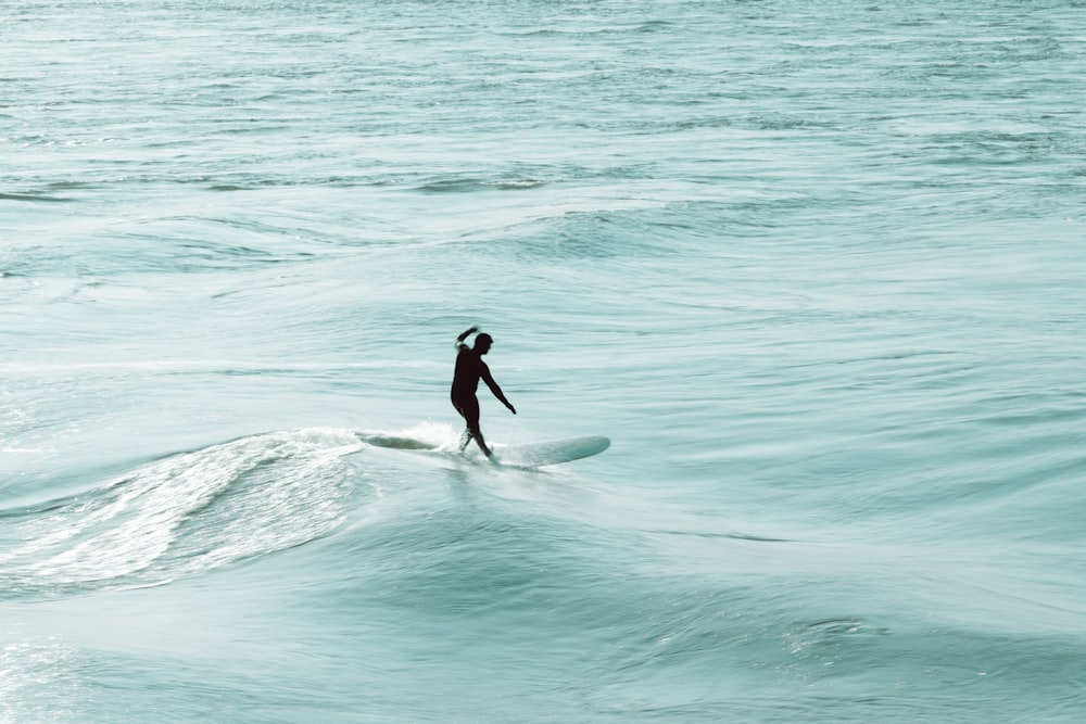 a person surfing on the waves