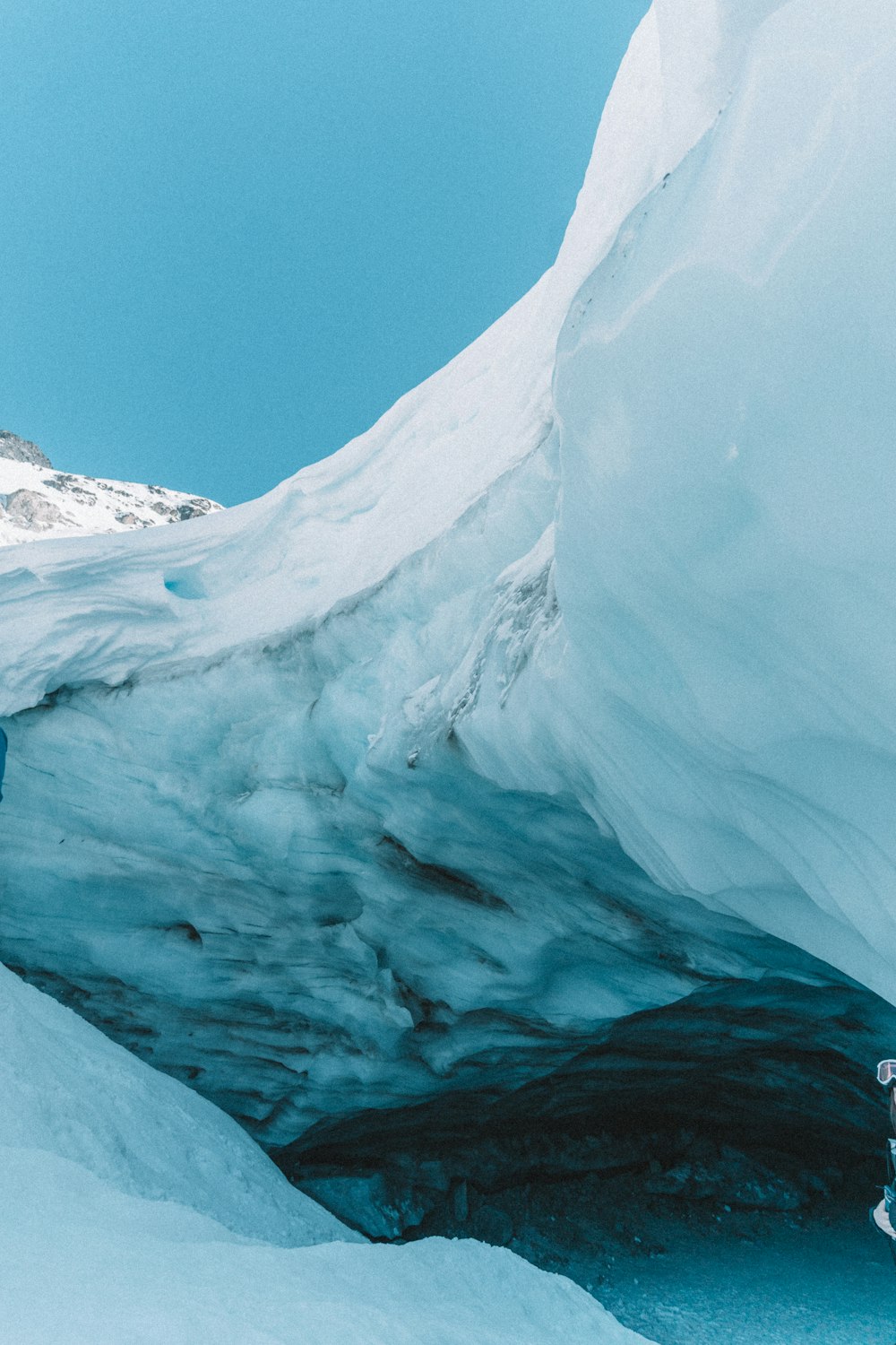 a large glacier with snow