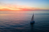 a sailboat in the middle of the ocean