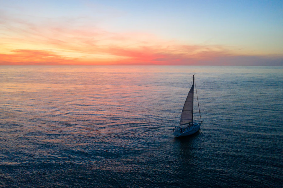 A sailboat in the middle of the ocean