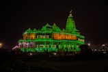 Evening view of the temple adorned with glowing lamps and floral garlands.