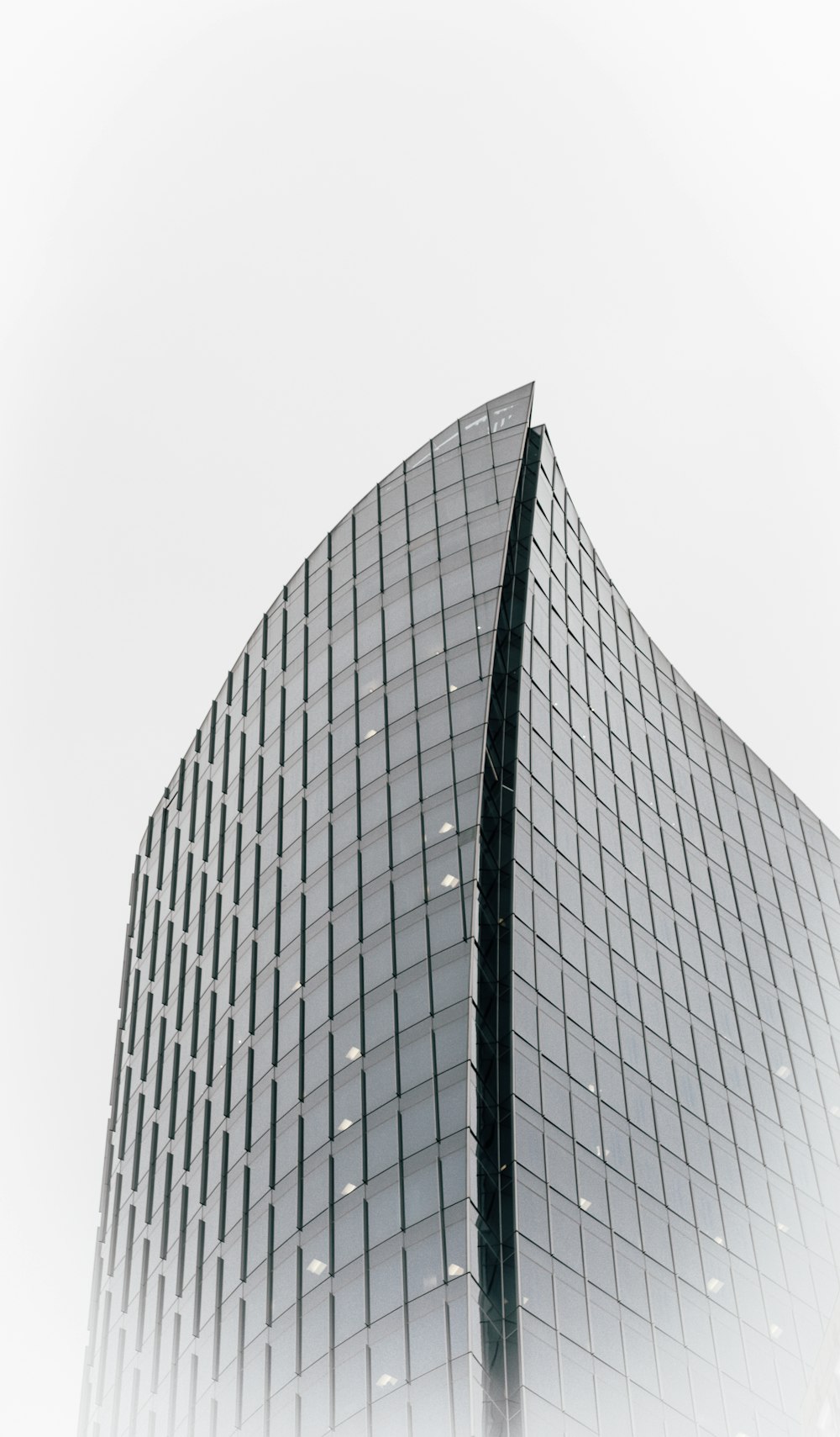 a tall building with a tall glass window