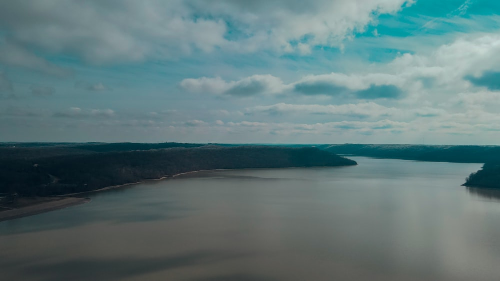 a body of water with land in the background