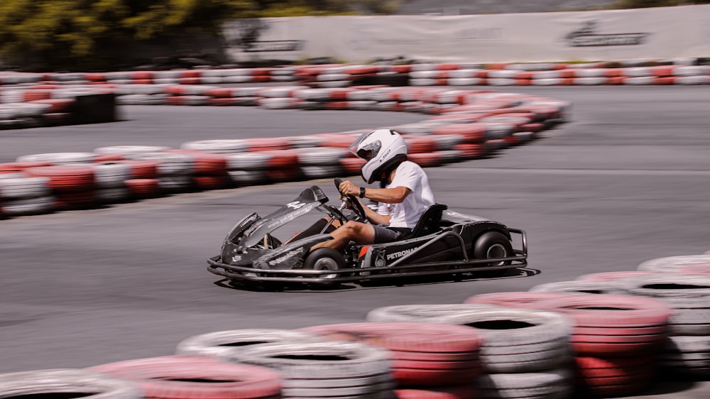 a man driving a go kart