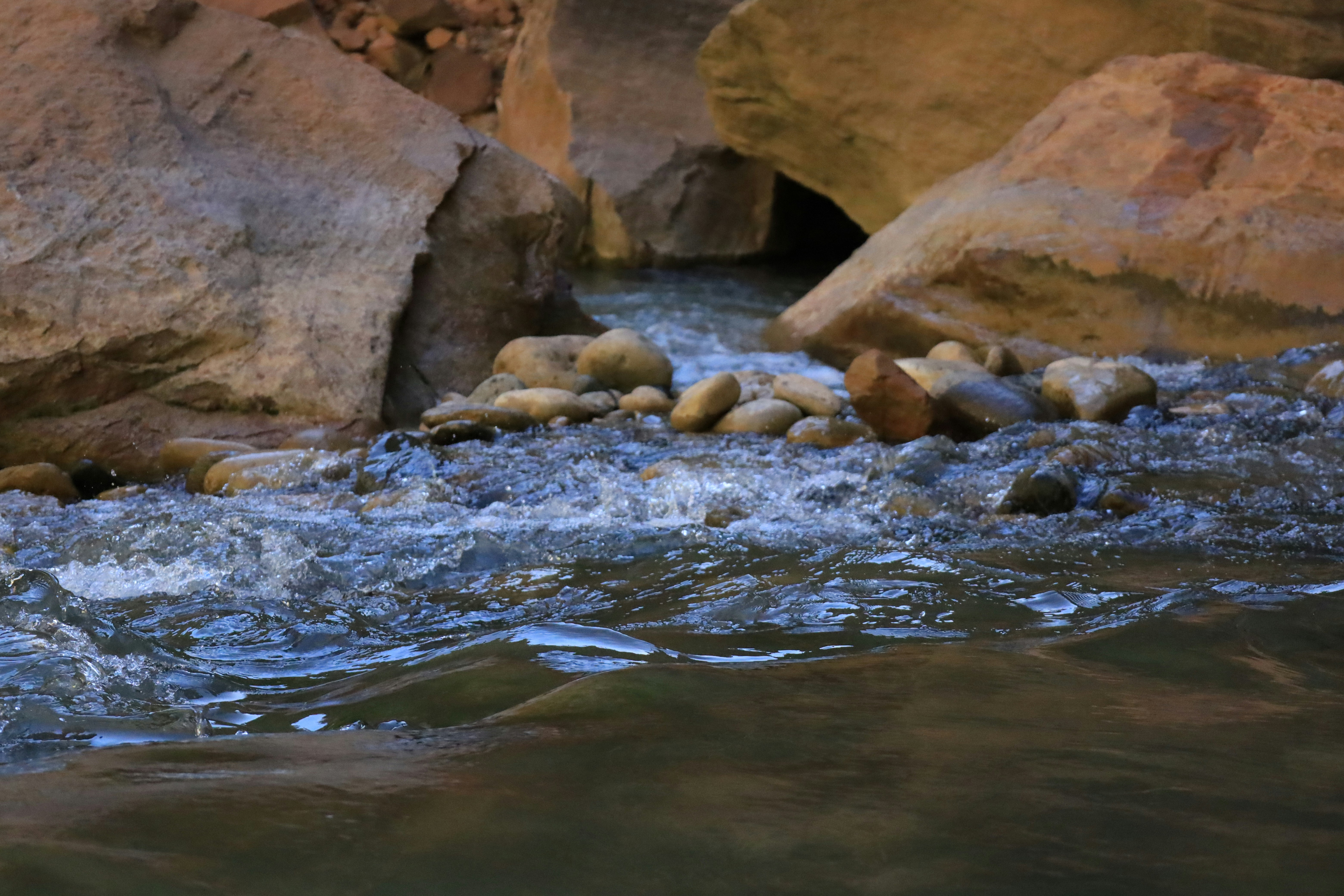 a river flowing between large rocks