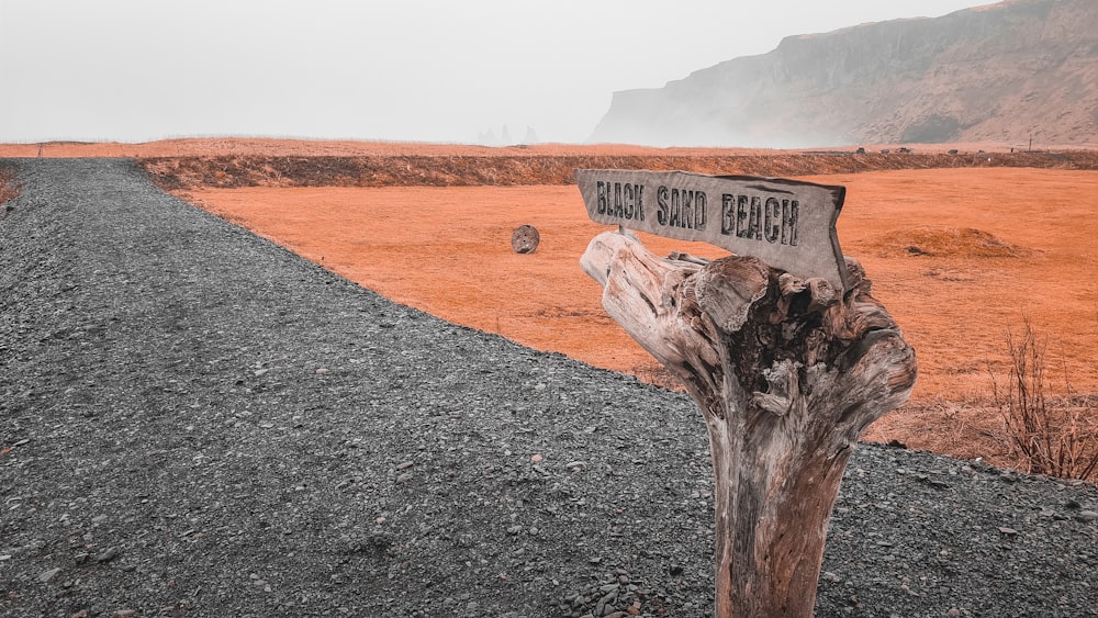 a sign on a tree stump