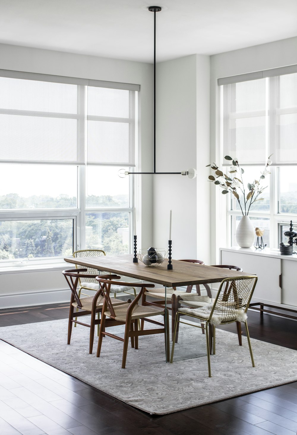 a dining room table with chairs