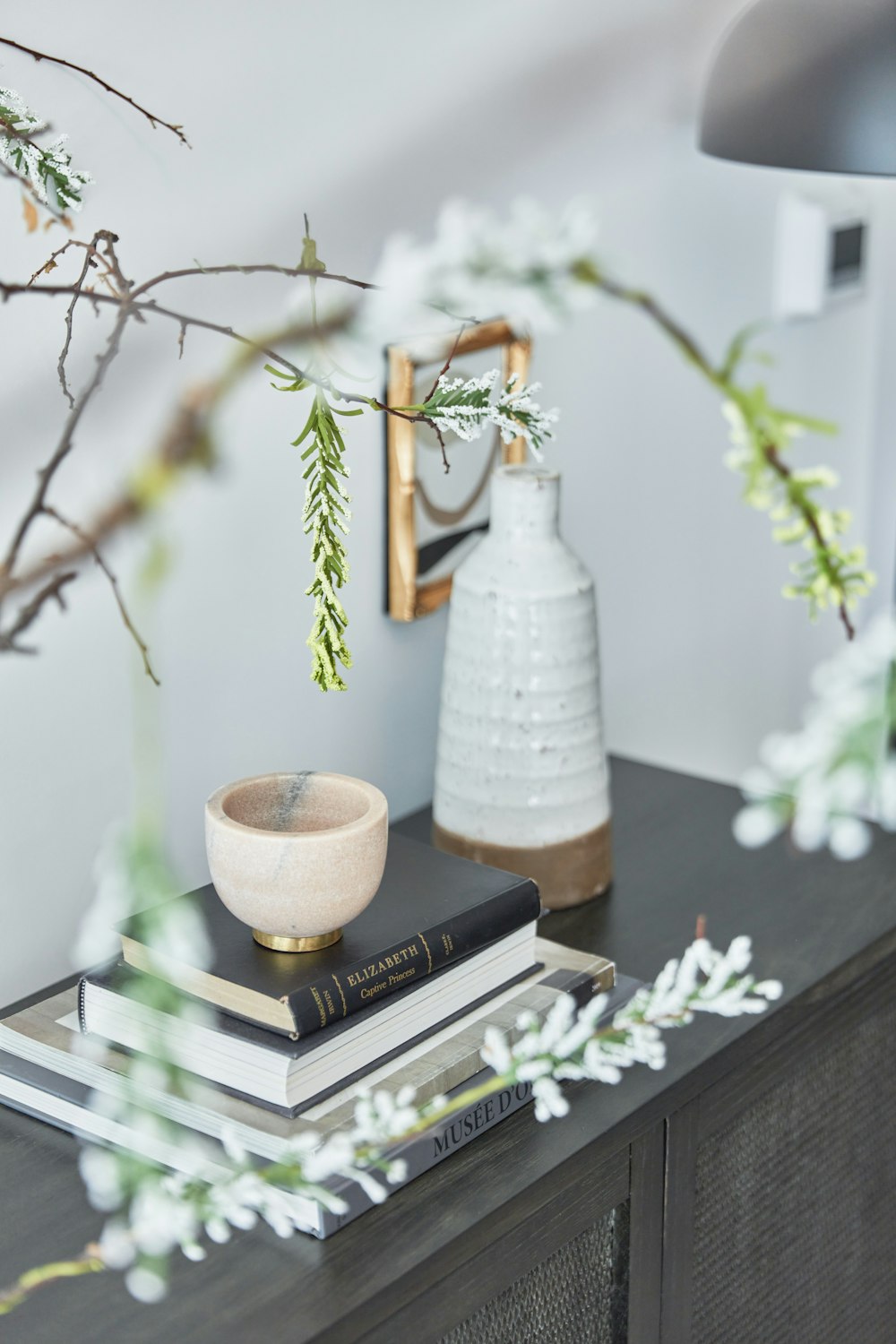 a vase with flowers on a table