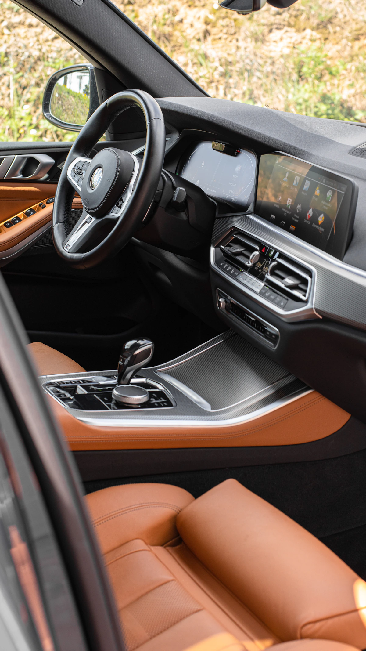 Luxury car interior with digital dashboard, infotainment screen, and center console
