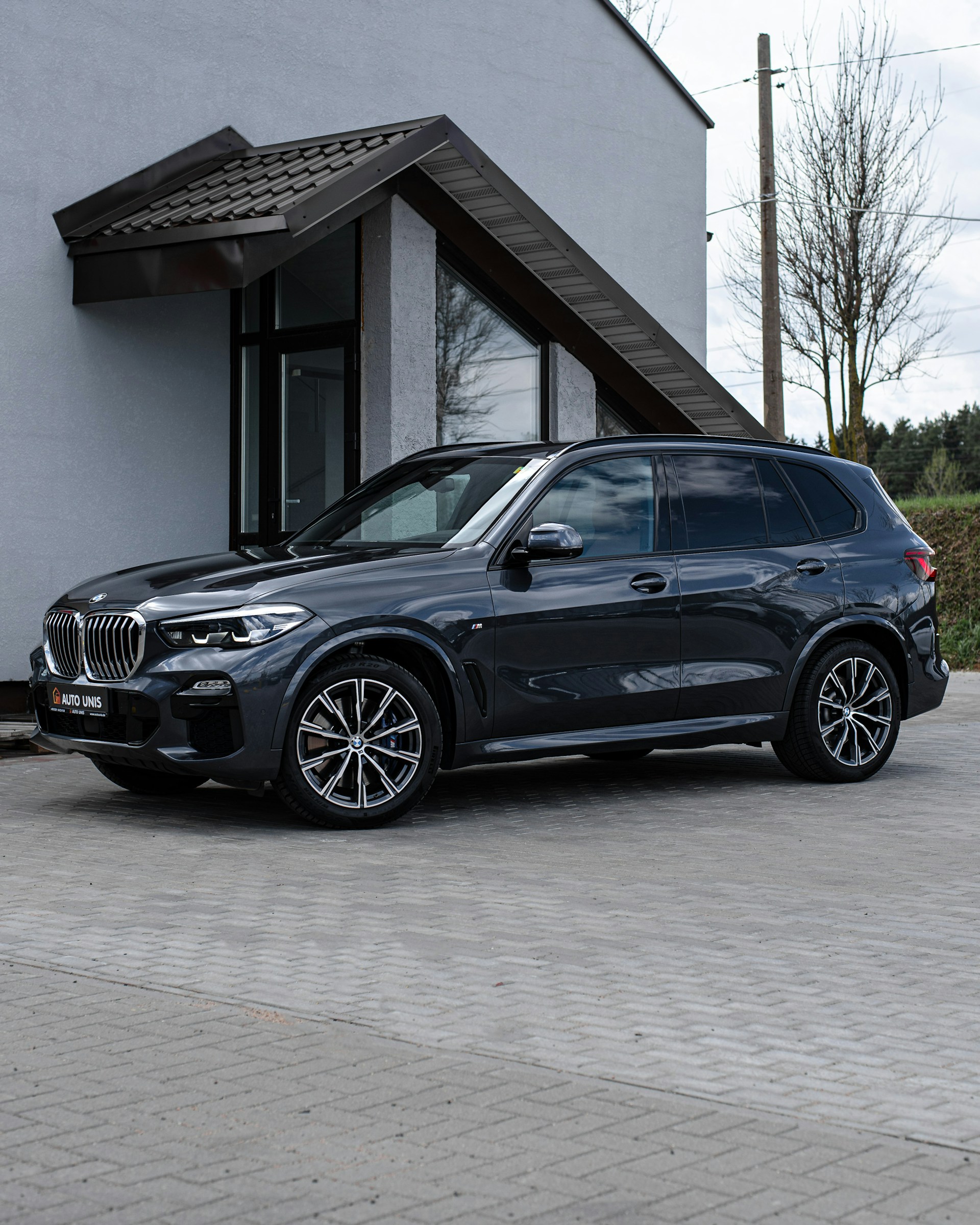 a black car parked outside a building