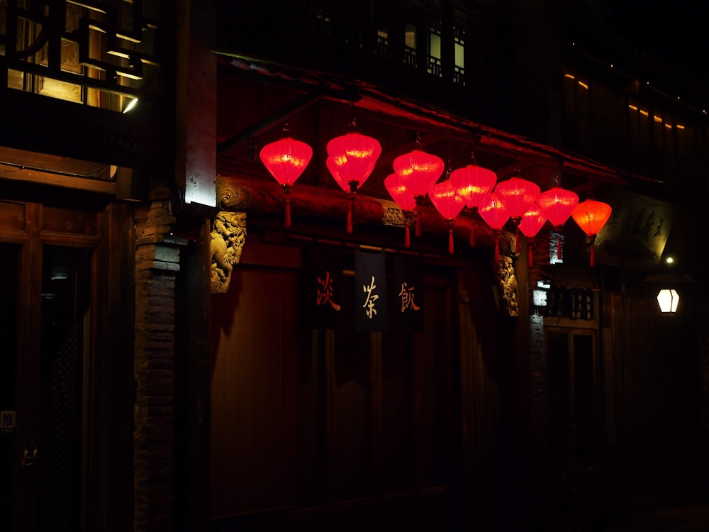 a group of red lanterns from a building